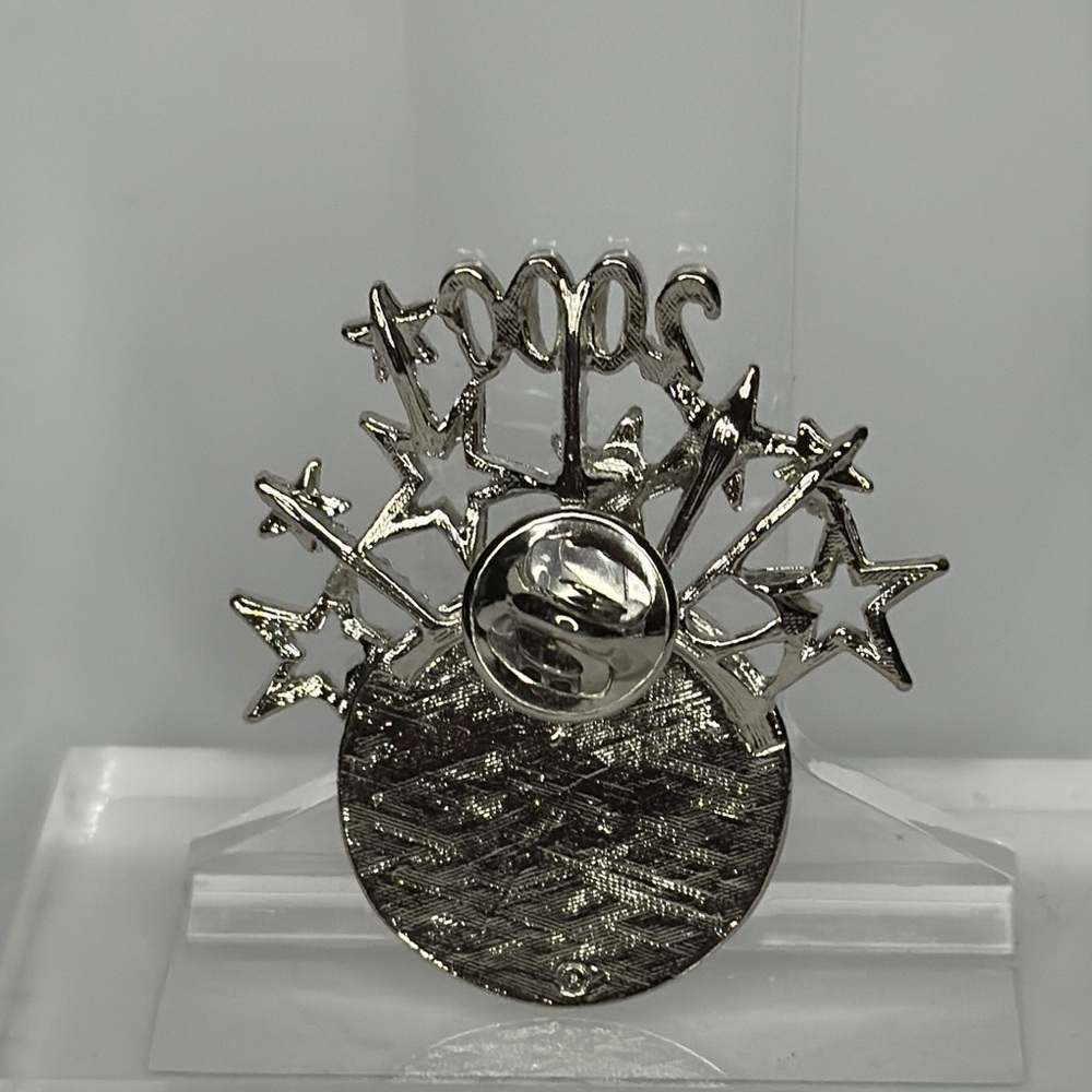 Silver and White Starburst Brooch with Roman Numeral Design - Picture 2 of 3